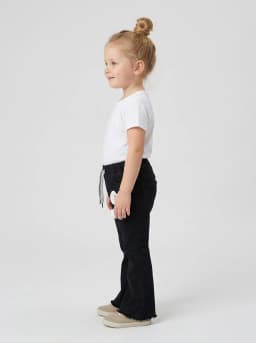 Girls Black Denim Flared Pants with Raw Hem and Charm Accent