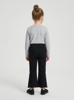 Girls Black Denim Flared Pants with Raw Hem and Charm Accent